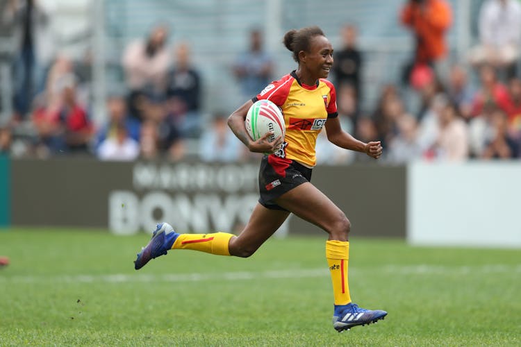 Papua New Guinea's Taiva Lavai races away from the Hong Kong defense for a try during 2019  HSBC Series Qualifier in Hong Kong (Photo: Mike Lee for World Rugby)